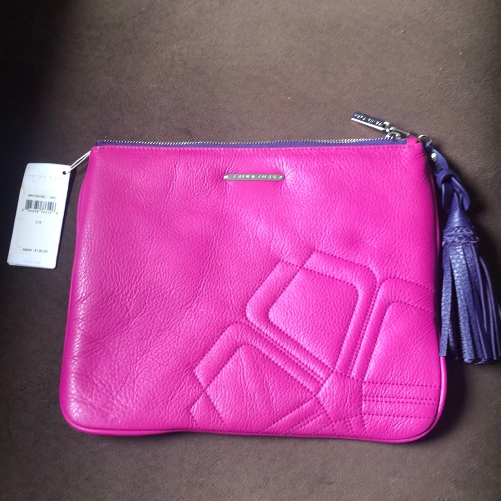 Trina Turk fuchsia clutch with purple tassel